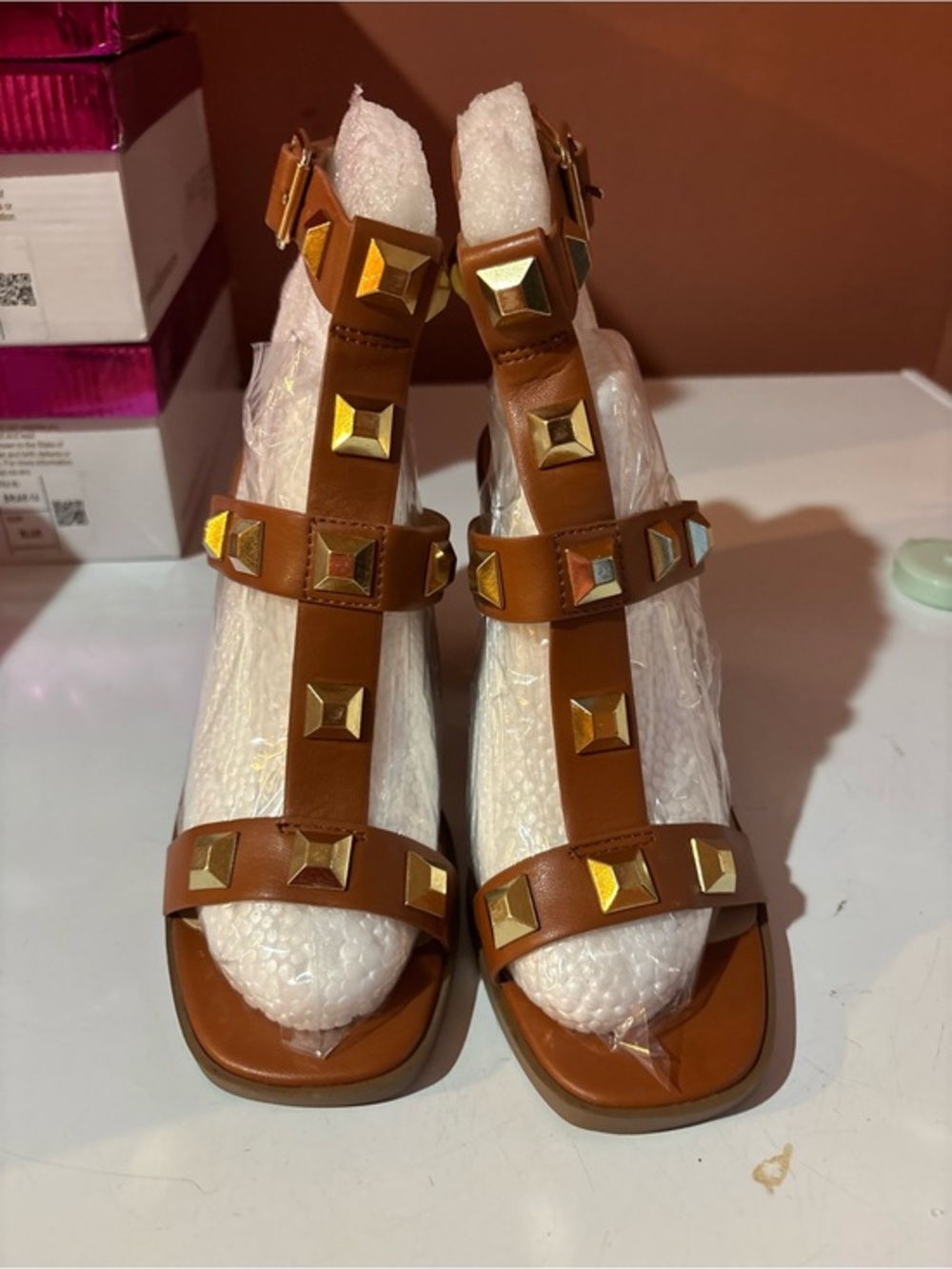 Soda Brown T-Strap Sandals with Gold Pyramid Studs